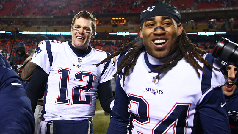 Stephon Gilmore and Tom Brady on the field after the 2018 AFC Championship game.